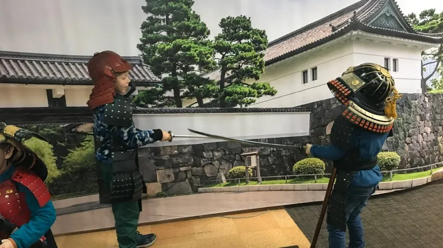 Kids dressed in samurai armour at the Kyoto Ninja Museum, Japan