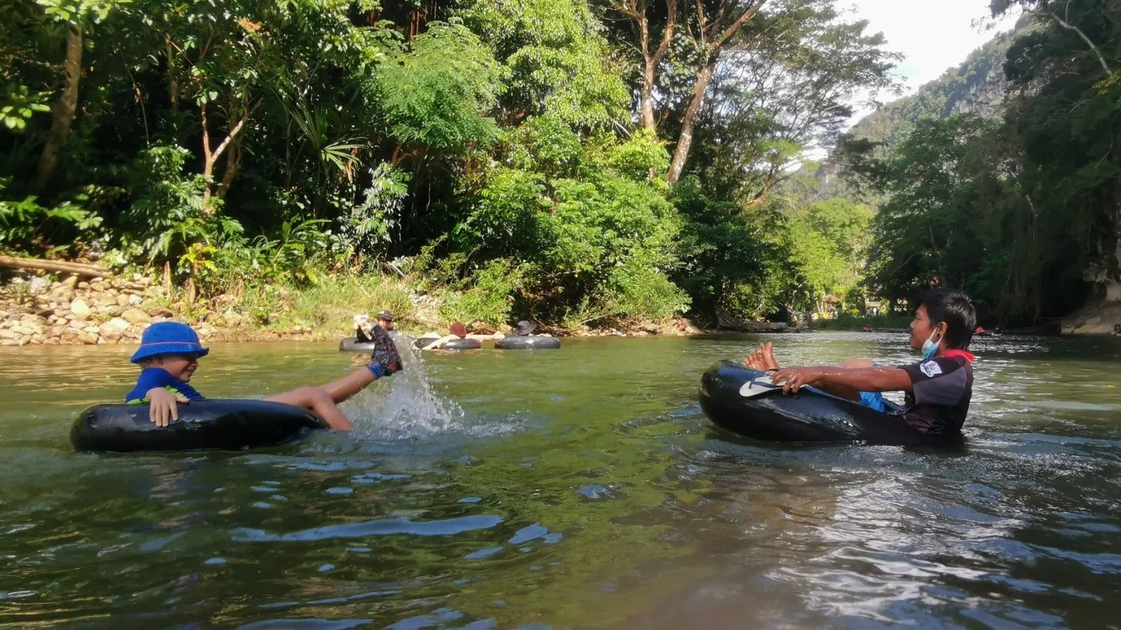 Kids river tubing at Baan Khao Sok Resort, Thailand